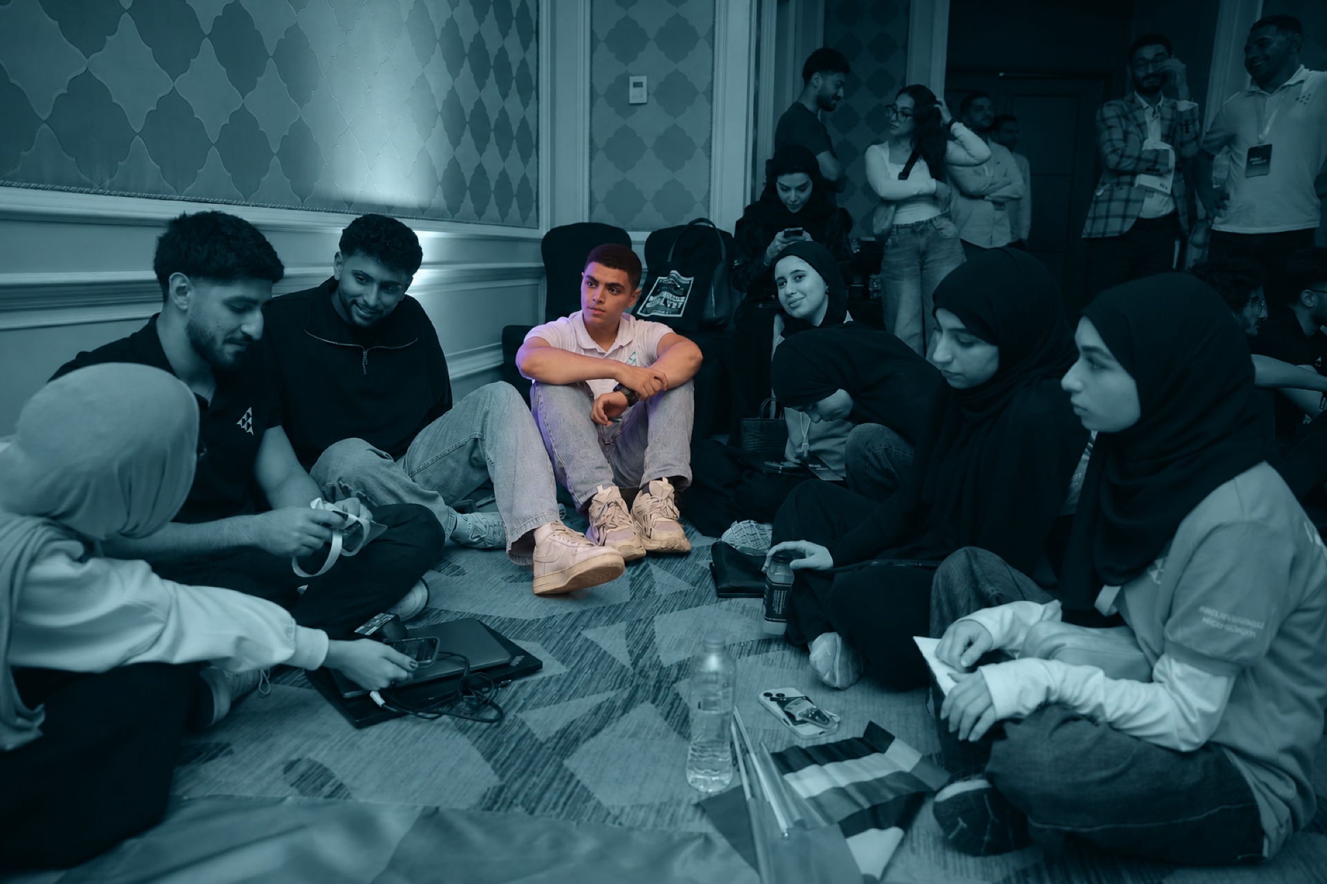 A large group of students in a discussion circle