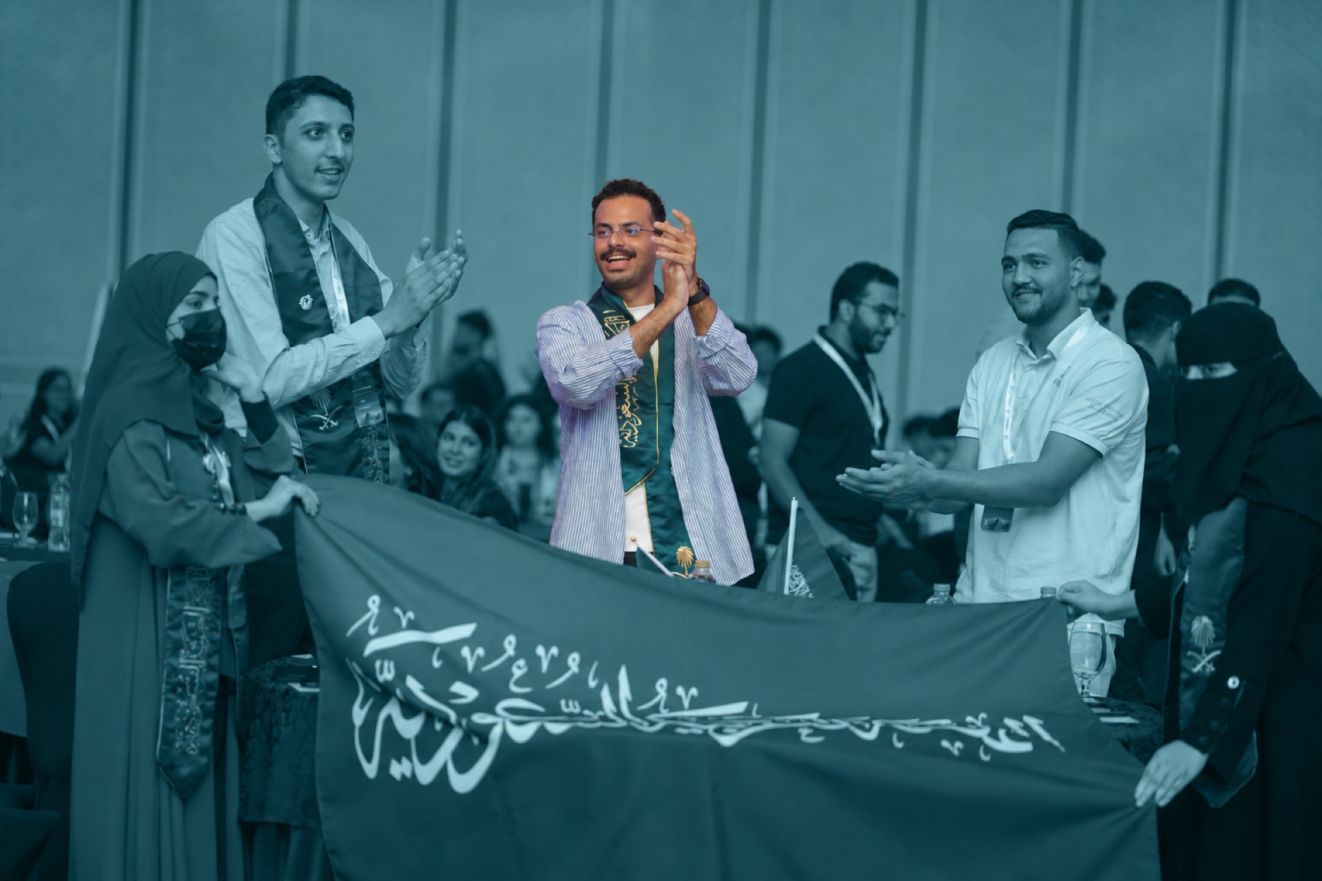 Students holding their national flag